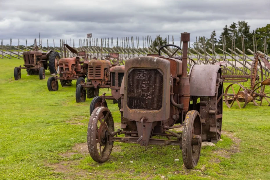 Technician performing sandblasting on heavy equipment to remove rust and old coating in Alberta